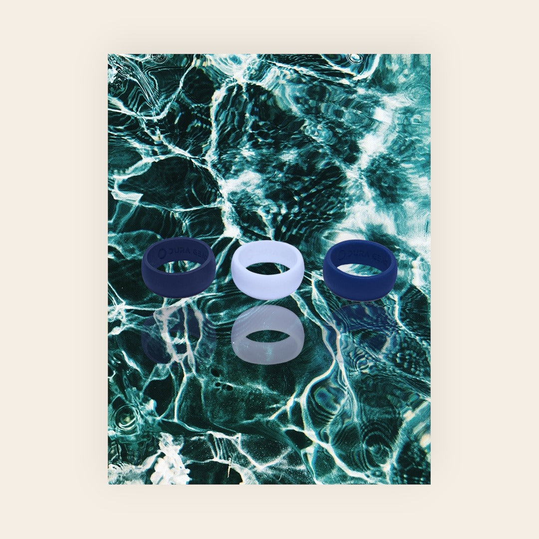 Dura Gear The Easy silicone rings in black, white and blue on water background